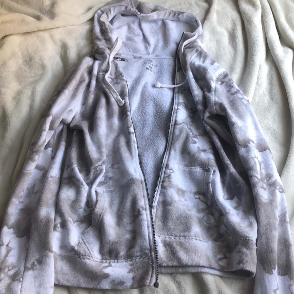 A light grey and white marble sweater.